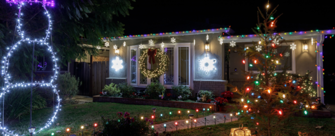 Christmas lights on a home at night.