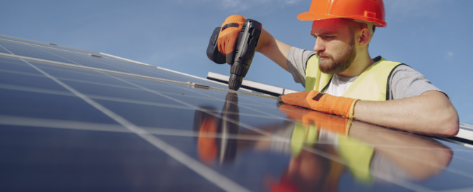 An installer is installing a solar panel by Precis Solar.